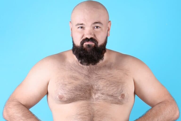 bearded bald man with chest growth