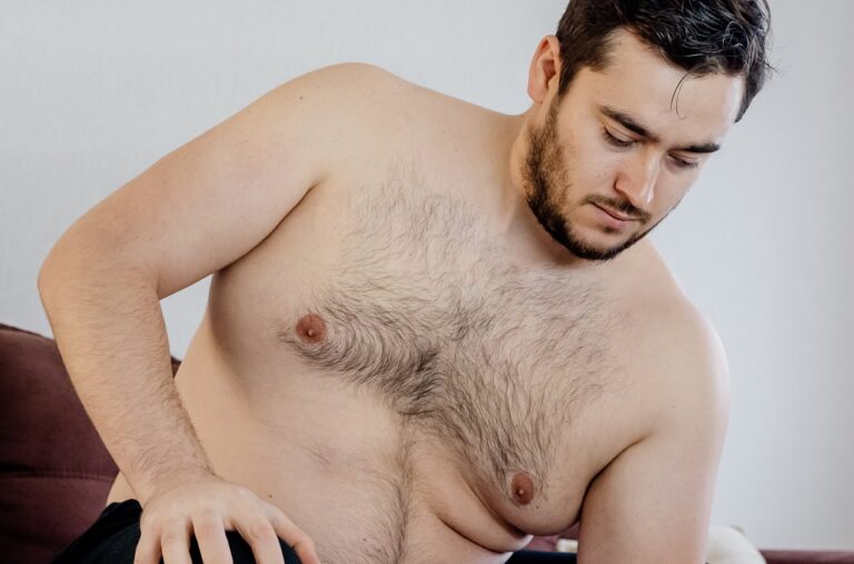 shirtless fat man lowering body