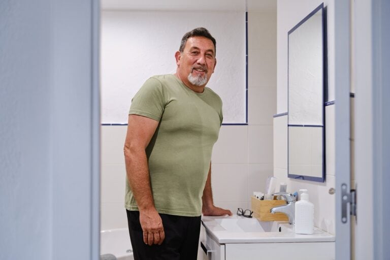 man in green standing